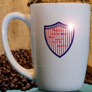 White ceramic coffee cup with patriotic Red, White, and Blue logo and "Real American" slogan, designed by a Vietnam Veteran and quality printed in Wisconsin, USA.