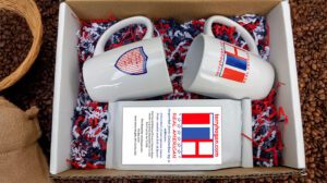 Set of two coffee cups and 12 oz. bag of Real American dark roasted espresso beans. Imported form Colombia by a veteran at "terryhogan.com."